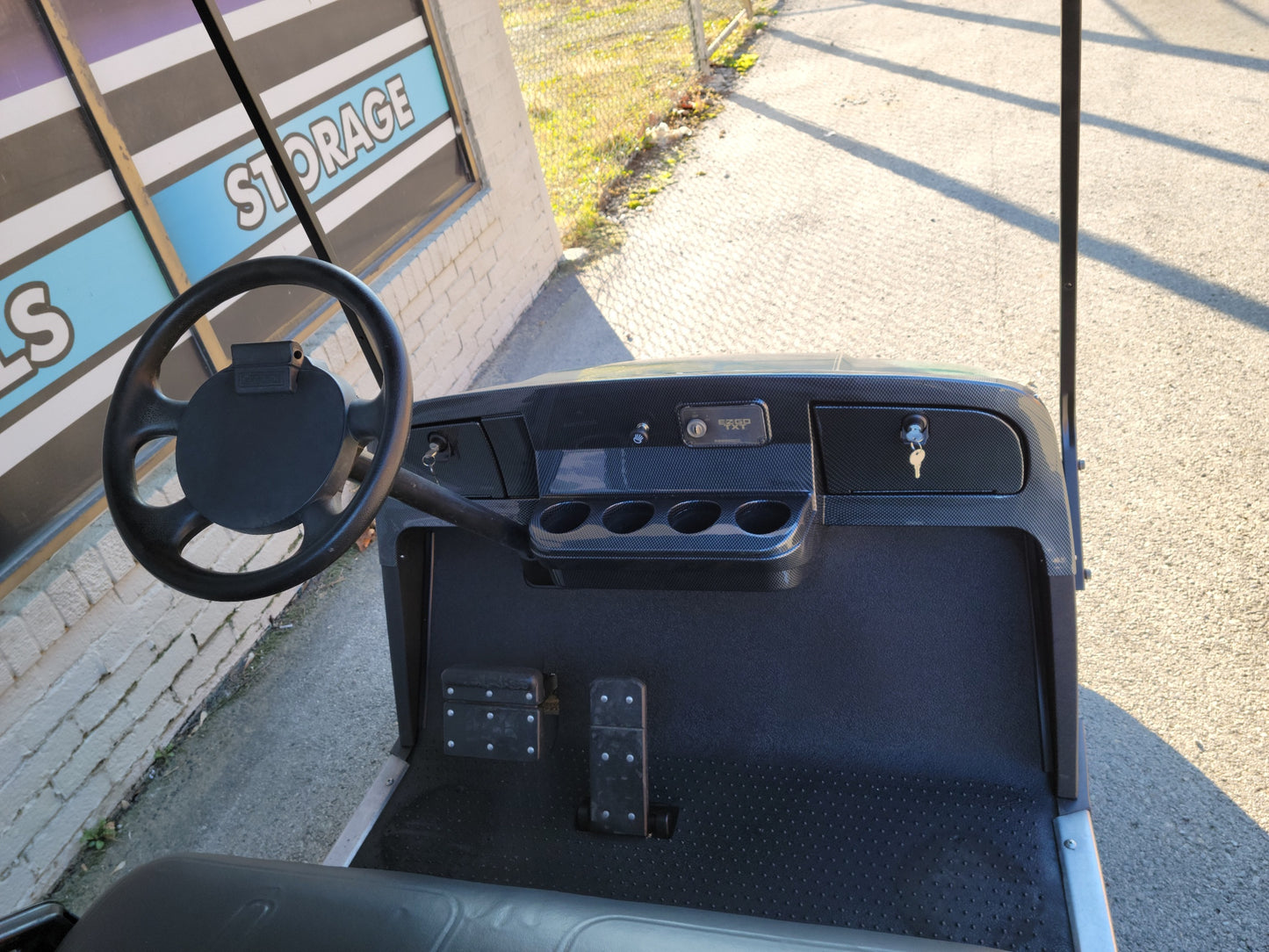 Gas EZGO TXT Golf Cart with black seats and dash SOLD